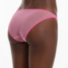 Sheer shimmer-pink mesh bikini briefs with slim double straps and a delicate, dressy going-out feel.