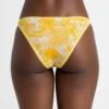 Sheer yellow floral mesh bikini briefs with slim double straps, a high leg and a bright dressy feel.