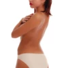 Smooth microfiber bikini briefs with a floral lace inset at the front hip and a low rise.