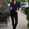 Women's breathable cotton-blend bodysuit with thong cut and full-length sleeves for everyday wear.