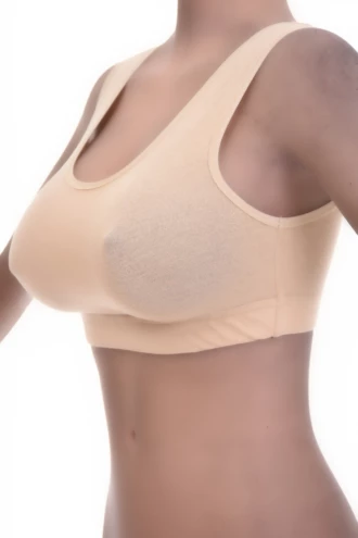 Soft breathable cotton bralette with an open back and wide straps across the shoulders, gentle wireless support.