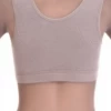 Soft breathable cotton bralette with an open back and wide straps across the shoulders, gentle wireless support.