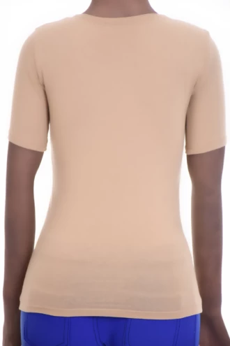 Soft cotton-blend tee with stretch and a low scoop neck, a slim feminine shape that follows the figure.