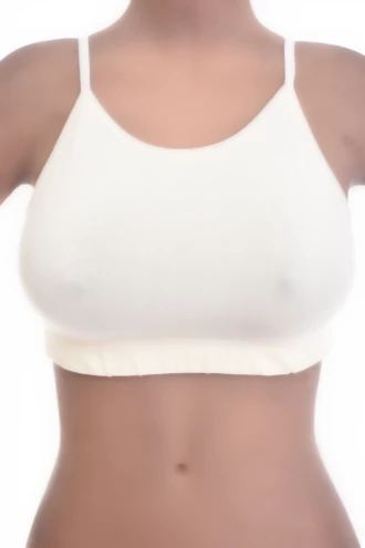 Soft-cup cotton bralette with a low scoop and delicate straps, wireless and breathable for gentle support.