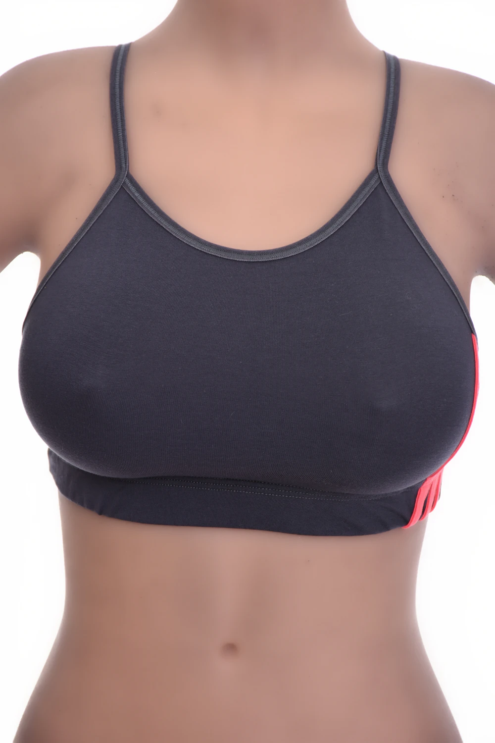 Soft-cup cotton bralette with a low scoop and delicate straps, wireless and breathable following the natural shape.