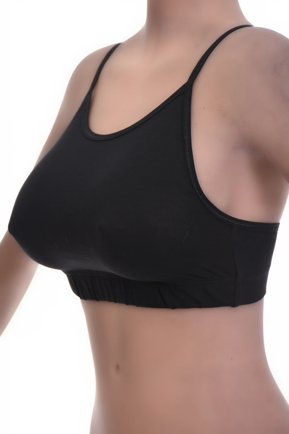 Soft cotton bralette with no wires or padding, a low scoop and fine straps for breathable everyday comfort.