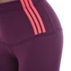 Close-up of eggplant cotton leggings waistband with three coral stripes, showing the fabric detail