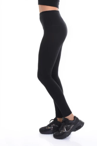 Black high-waisted cotton leggings, side view highlighting the smooth soft everyday fabric and slim fit