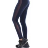 Navy blue high-waisted cotton leggings with a vertical side mesh panel, side view of the slim cut