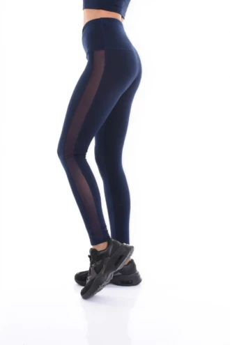 Navy blue high-waisted cotton leggings with a vertical side mesh panel, side view of the slim cut