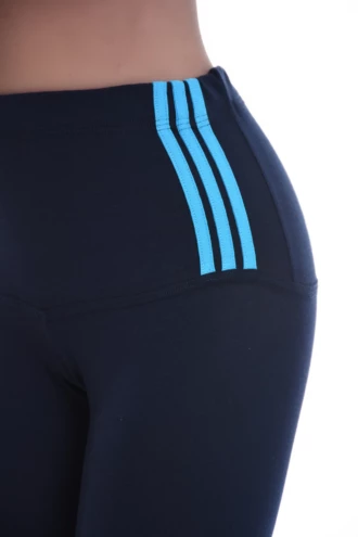 Close-up of navy cotton leggings waistband with three light blue stripes, showing the fabric detail