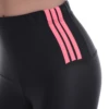 Close-up of black microfiber leggings waistband with three pink stripes, showing the fabric detail