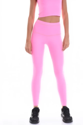 Pink high-waisted microfiber leggings, front view of the leg showing the dense smooth fabric