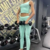 Reseda green high-waisted microfiber leggings, upright front view of the smooth athletic fit