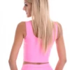 Pink sports set, back view of the smooth microfiber top worn with the matching leggings