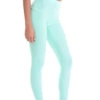 Reseda green microfiber leggings with a high crossover waistband, side view of the slim cut