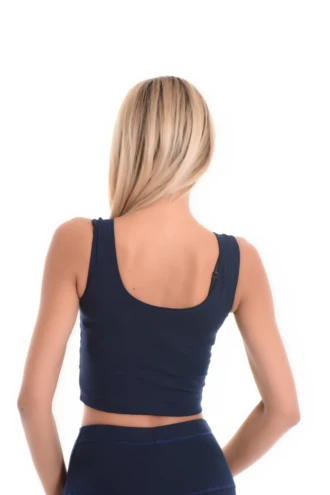 Slim soft cotton tank with a low scoop and wide straps, breathable against the skin with an easy pull-on shape.