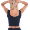 Slim soft cotton tank with a low scoop and wide straps, breathable against the skin with an easy pull-on shape.