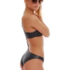 Asymmetric black swimsuit with single shoulder strap and waist cutout in slightly sheened fabric.
