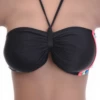 Black bandeau bikini top with a bright pink, blue and green stripe trim along the side for a sporty edge.