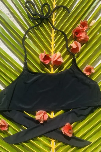 Black halter bralette bikini top with a slim neck cord and a soft scoop front, light and unpadded for comfort.