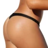 Low-rise black swim thong with no ties that pulls on and sits close, stretchy quick-drying polyamide for tanning.