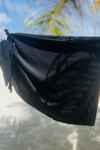 Black microfiber beach pareo from Tiara Galiano, smooth lightweight wrap that packs down small and ties at the waist.