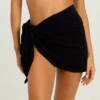 Soft black microfiber sarong wrap for women, quick-drying one-size cover-up that knots low on the hips poolside.
