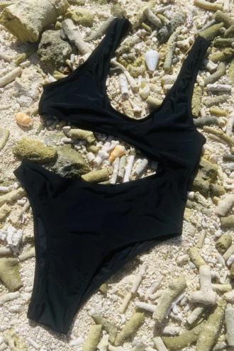 Black tank-style swimsuit with curved side cutout, tie back and a slightly cheeky back cut.