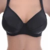 Black underwire bikini top with unpadded soft cups for a natural line and adjustable straps over the shoulders.