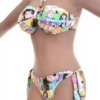 Colorful comic-print bandeau bikini set with Brazilian-thong tie-side bottom in smooth polyamide.