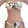 Comic-book print bandeau bikini top worn as halter or strapless with a tie back for women.