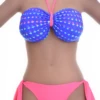 Confetti-dot bandeau bikini top worn as halter or strapless with a tie back for women.