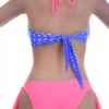 Solid coral bikini bottom with adjustable side ties and standard coverage in quick-drying fabric.