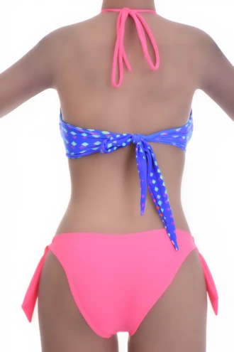 Solid coral bikini bottom with adjustable side ties and standard coverage in quick-drying fabric.