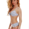Dot-print underwire bikini top with molded push-up cups and supportive hook-and-eye back.