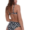 Dot-print underwire bikini top with soft unpadded cups and hook-and-eye back for natural shape.