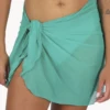 Jewel-toned emerald mesh sarong wrap for women, weightless one-size beach cover-up that knots low on the hips poolside.