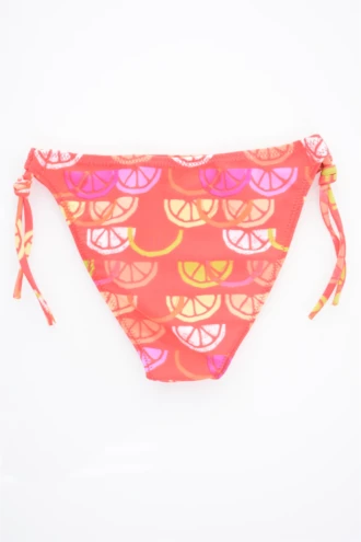 Coral girls' swim bottom with a fruity orange and lemon print and adjustable side ties, light quick-drying fabric for sunny days.