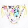 Girls' tie-side bikini bottom by Tiara Galiano in a colorful pop-art comic print on a yellow base with matching side ties, quick-drying polyamide.