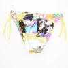 Yellow comic-book print girls' swim bottom with adjustable side ties, light quick-drying fabric for the pool, beach or garden.