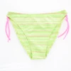 Girls' tie-side bikini bottom by Tiara Galiano in a soft green stripe with pink side ties and quick-drying polyamide fabric.