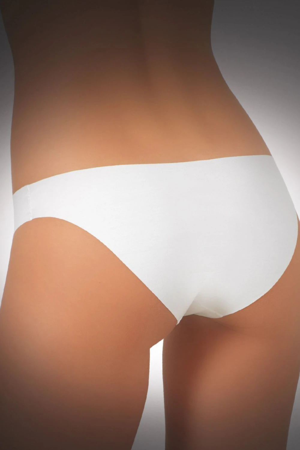 Seamless cotton bikini briefs by JADEA with no seams or elastic, leaving no lines under clothes.