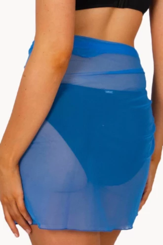 Soft light blue mesh sarong wrap for women, weightless one-size beach cover-up that knots low on the hips by the pool.