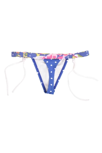 Mixed-print swim thong with a pink-and-yellow floral waistband over a dotted body, low minimal cut with white ties.