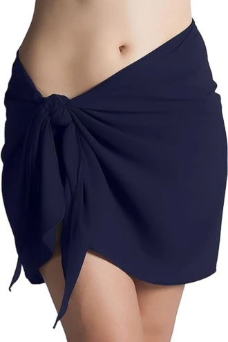 Navy microfiber sarong wrap for women, quick-drying packable one-size beach cover-up knotted low on the hips.