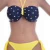 Navy polka-dot bandeau bikini set with bright yellow tie-side bottom in smooth polyamide.