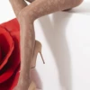 Sheer 20 denier OMSA Fiori tights in beige with an all-over floral pattern worked across the whole leg.