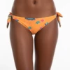 Orange tie-side bikini bottom in a tropical floral print with blue, pink and green blooms and bow hip ties.