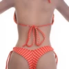 Skimpy orange thong bikini bottom with adjustable side ties in lightweight polyamide.